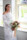 Portrait of the bride in her wedding dress and holding her wedding bouquet in front of a window at the Ballyseede castle hotel, Tralee.