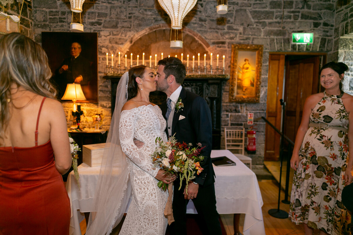The bride and groom share a tender kiss after tying the knot at Ballyseeede castle in Tralee.