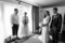 Black and white photograph of bride with her parents and brother in a room at dromquinna Manor.