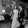 Black and white photograph of the bride and groom exiting their wedding venue at Ballyseede hand in hand.