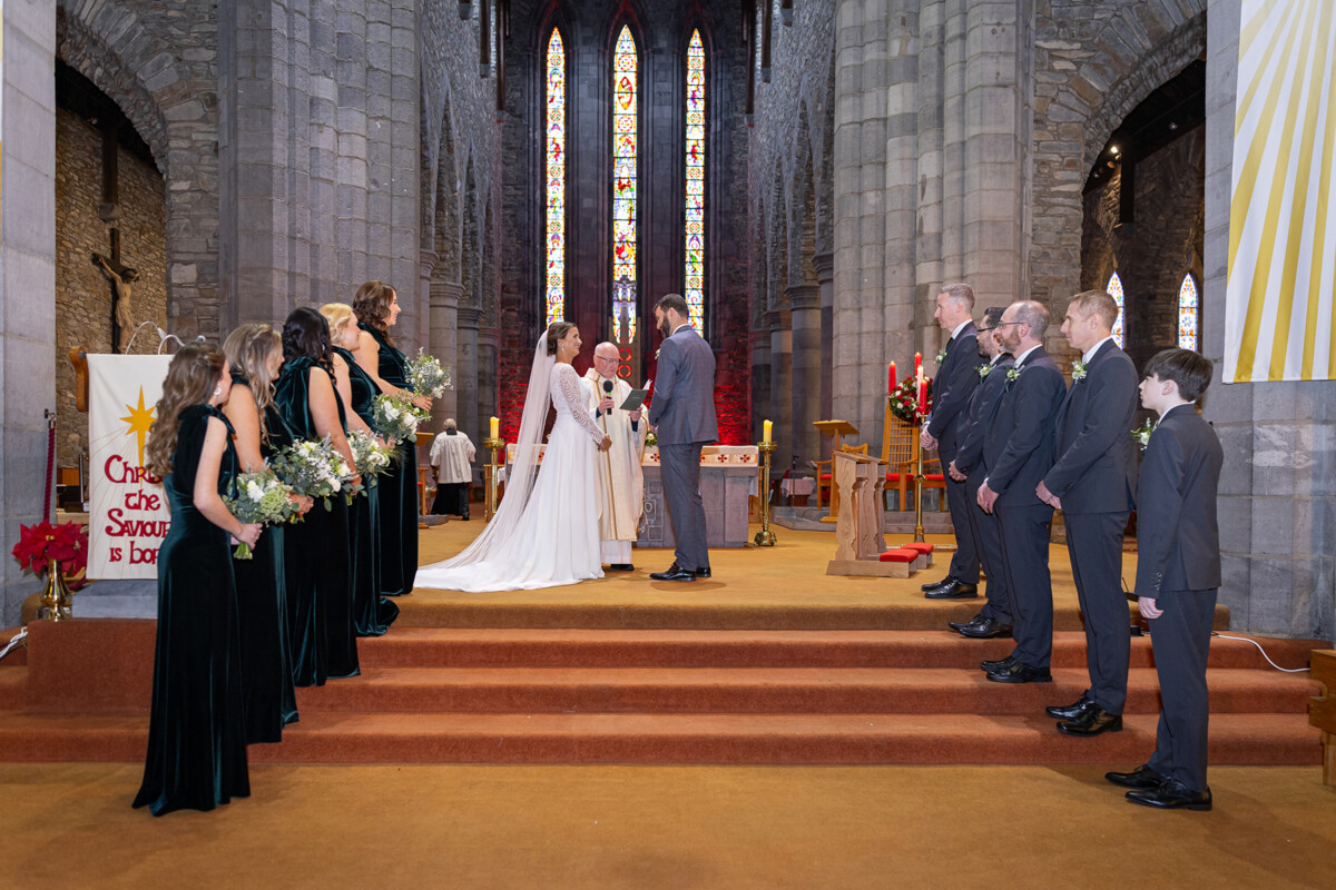 Bride and groom stood at the top of the alter during their wedding ceremony in Killarney.