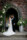 Bride and groom share a kiss stood under the entrance arch of the little chapel by Dromquinna manor, Kenmare.