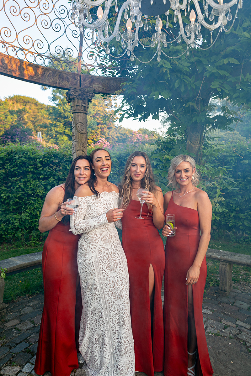 The bride and bridesmaids standing in the gazebo at Ballyseede, Tralee.