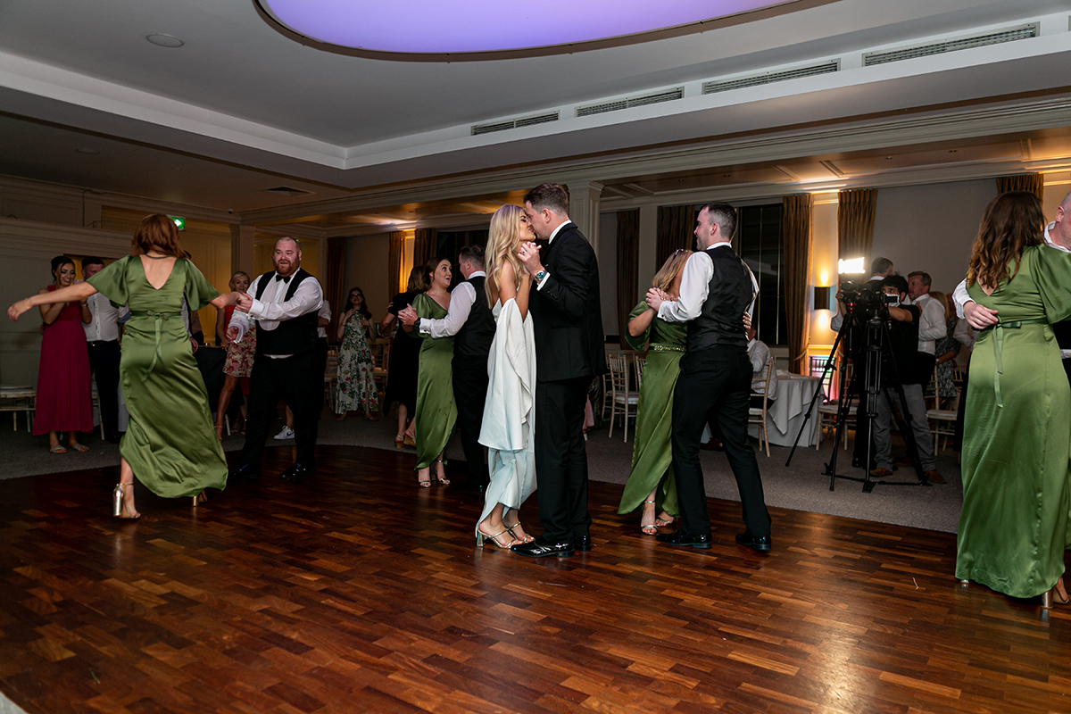 bride and groom dancing amongst guests at the dunloe hotel killarney