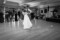 Black and white photograph of groom dipping his bride on the dancefloor at the Heights Hotel.