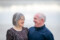 close up beach portrait of husband and wife smiling at one another with a soft blurry background at ballyheighue beach
