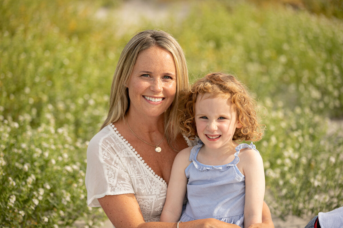 close up beach portrait of mother and daughter at fenit beach with soft background