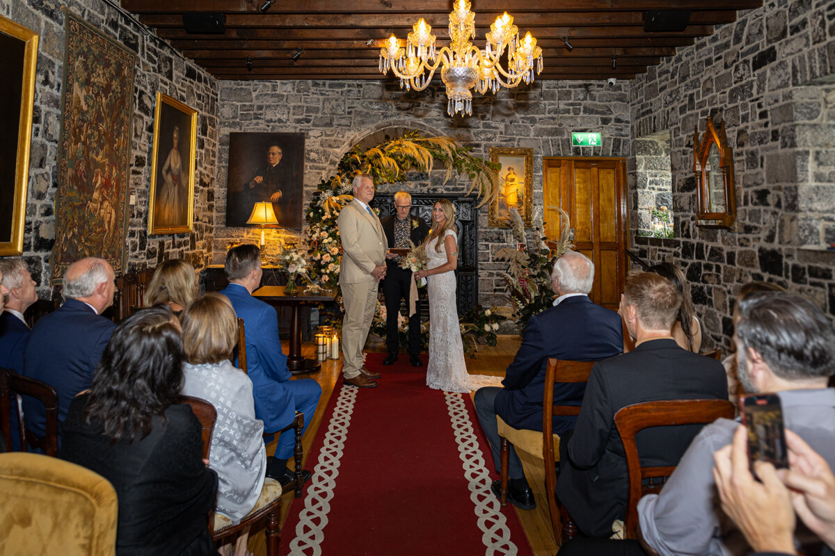 Husband and wife at the top of the alter during the wedding vow renewal ceremony at Ballyseede castle.